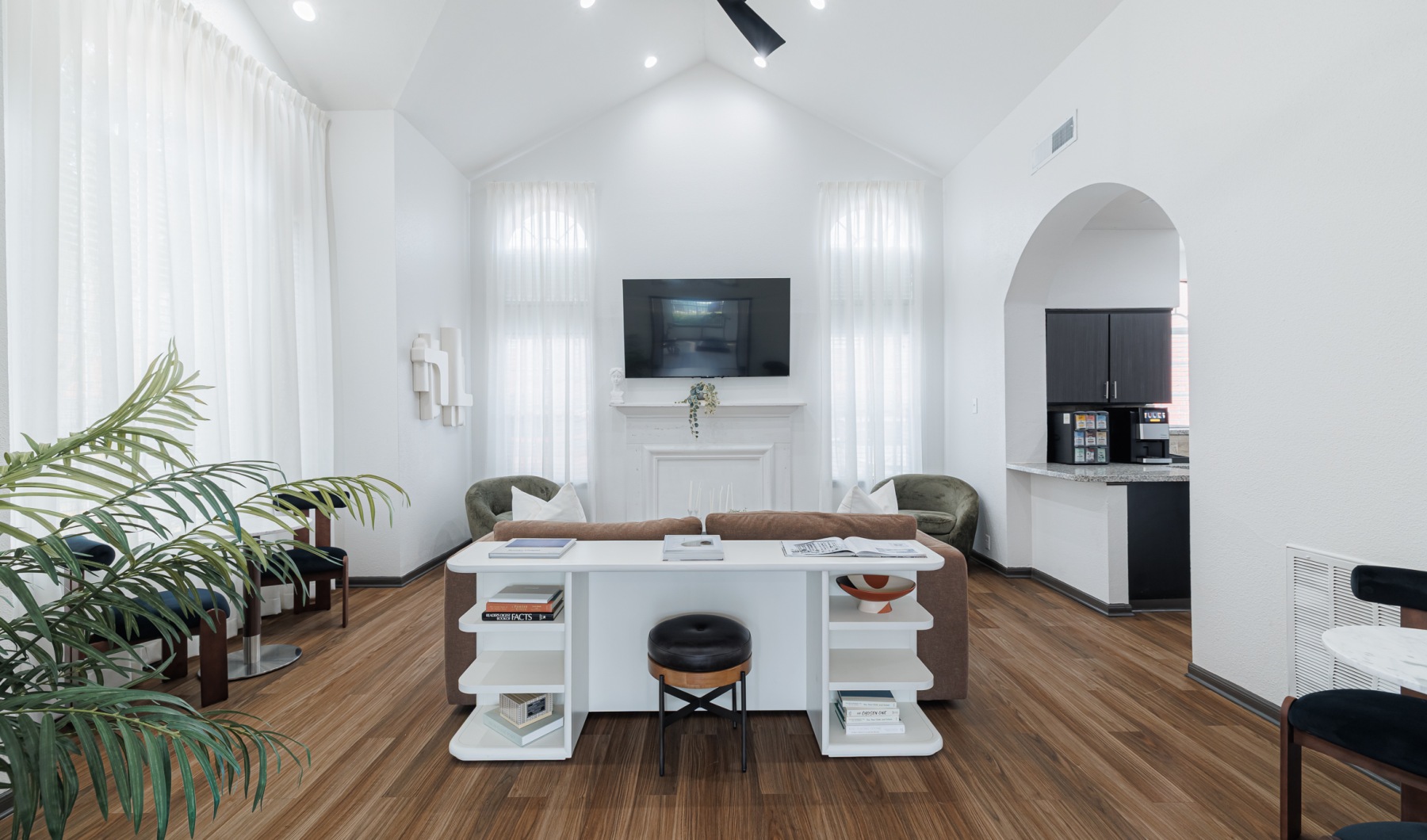 large room with windows and fireplace