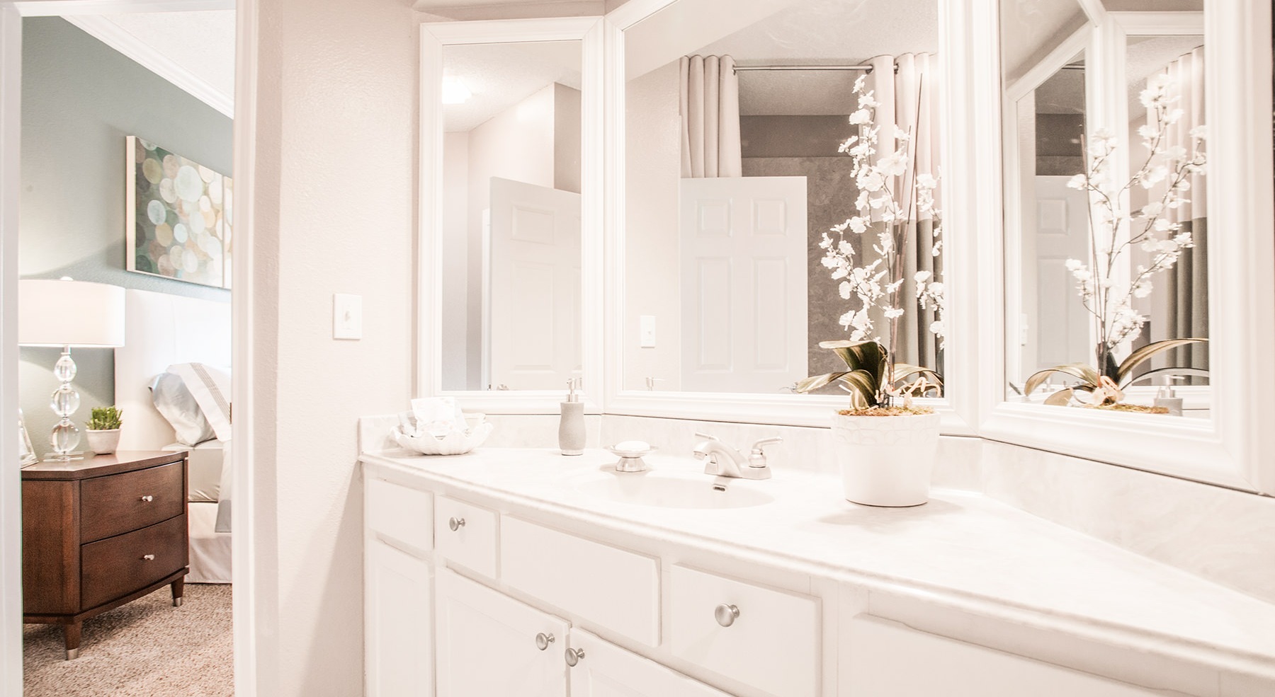 bathroom with mirrors and a sink