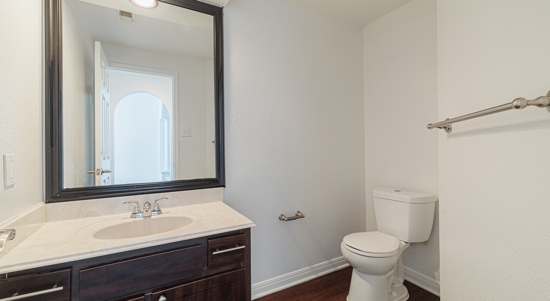 bathroom with sink mirror and toilet