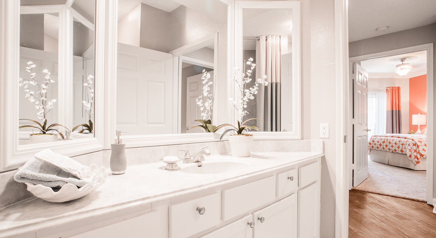 bathroom with mirrors and a sink