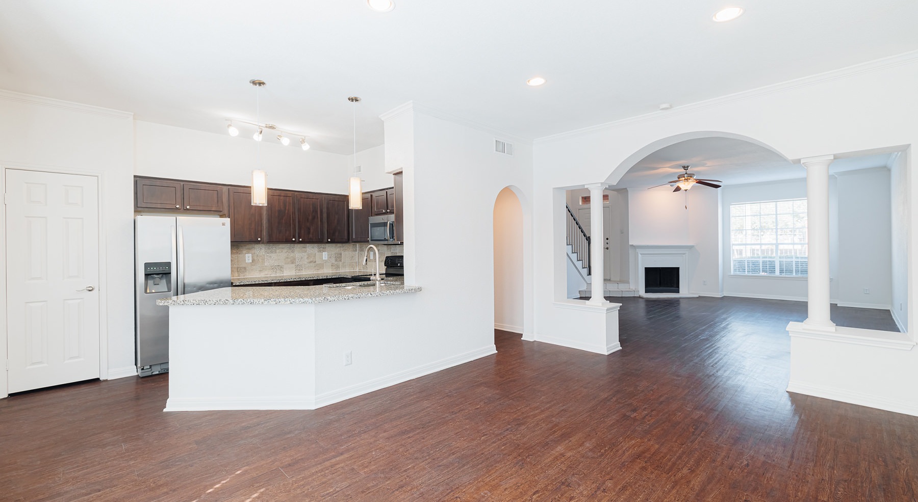 dining room with hardwood floors ad kitchen in view